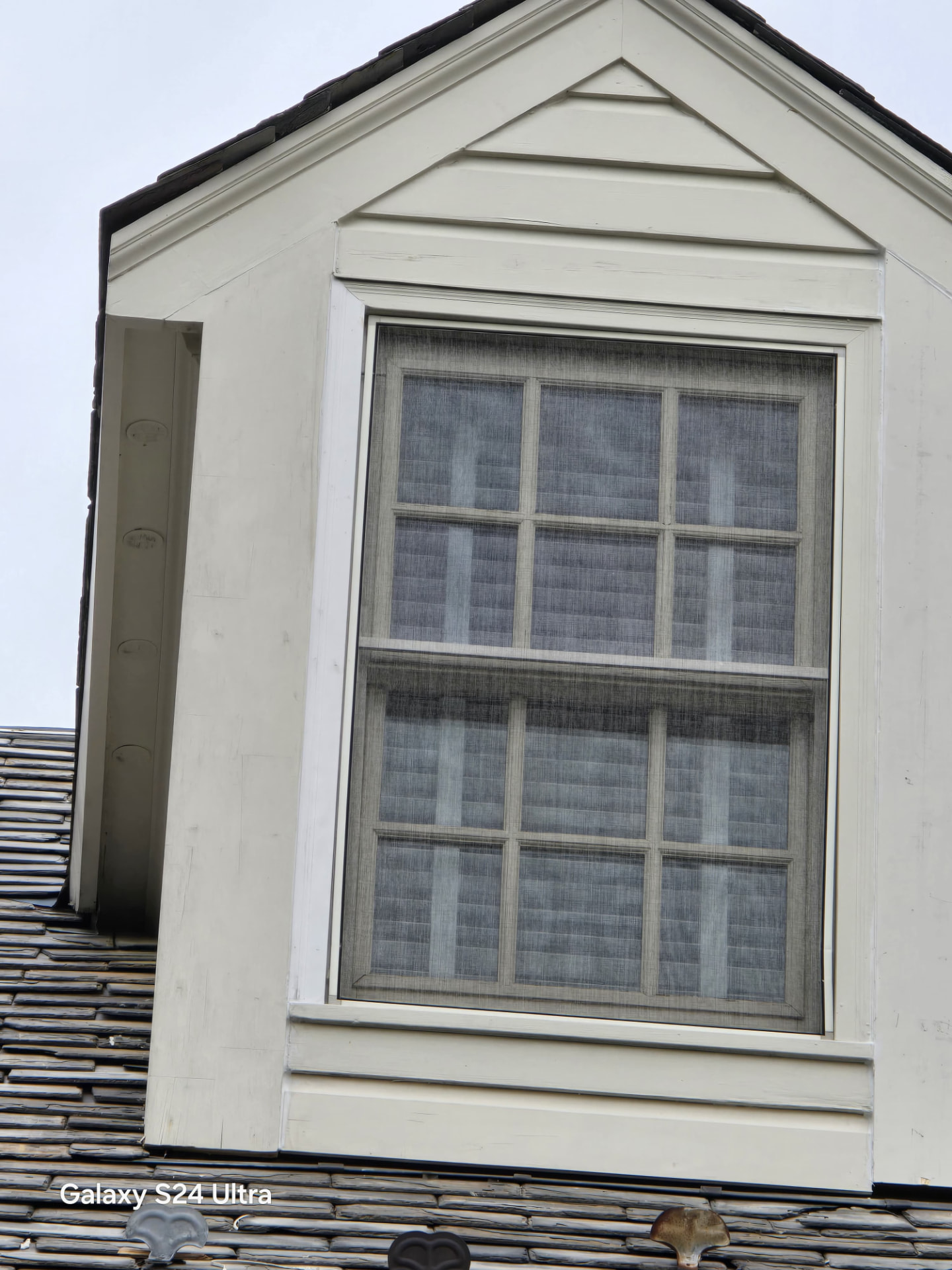 After — Dormer restoration — rotted trim repaired, scraped and repainted