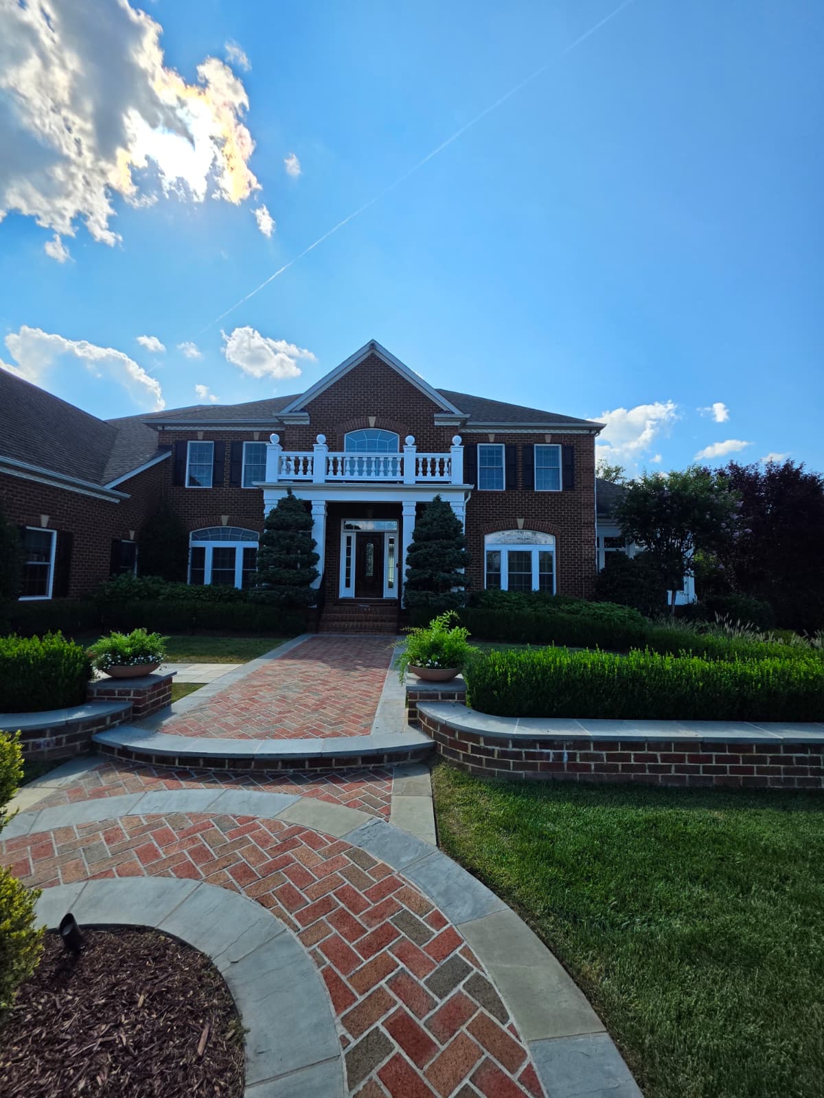 Brick colonial exterior after exterior detail work — Real AJN Handyman LLC project