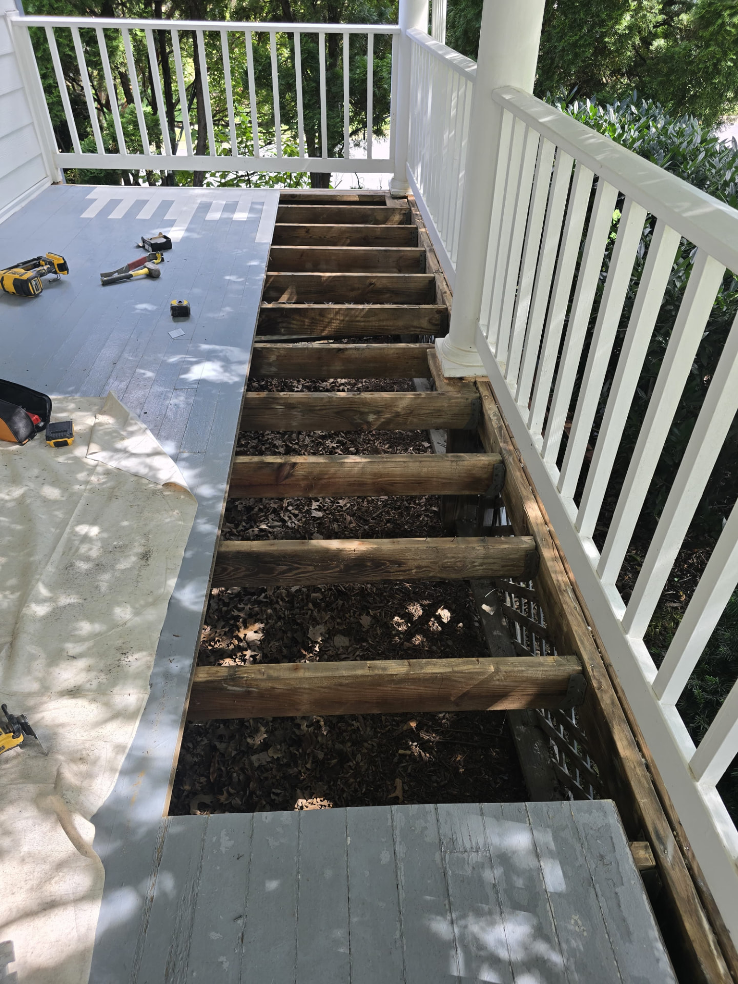 Before — Structural repair — joists replaced and deck refinished